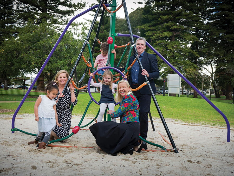 Philanthropist Nicola Forrest, Professor Donna Cross and CoLab Co-director David Ansell encourage friends Emelie, Brady and Summer to have a go on the climbing frame