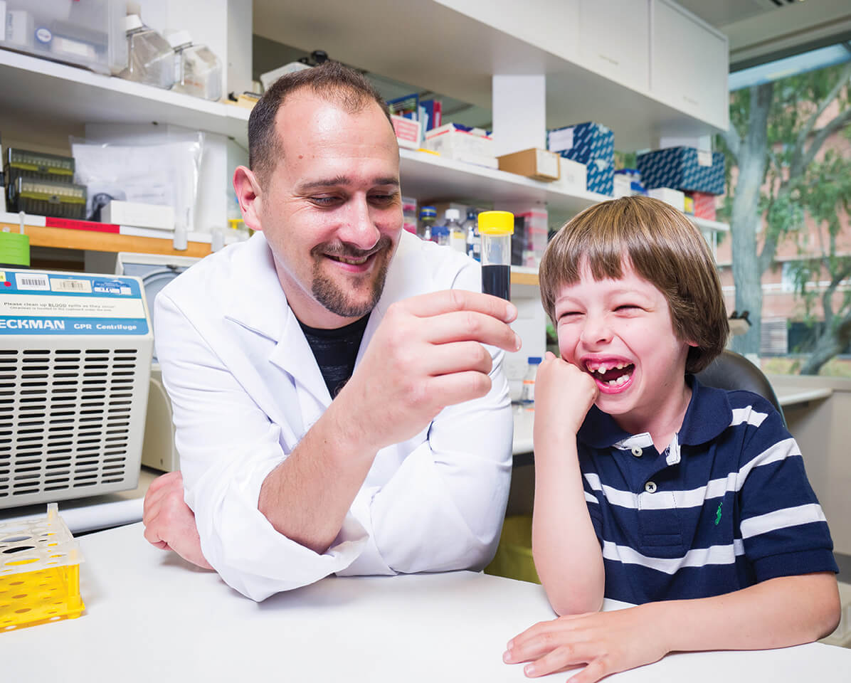 Dr Anthony Bosco and Samuel share a laugh in the lab